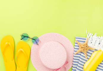 Blue beach accessories on color background, top view. Copy space for text