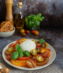 Burrata with Colorful Tomatoes, Basil, Olive Oil and Bread
