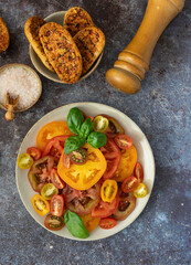 Close Up of Sliced Tomatoes with Basil, Bread and Sea Salt