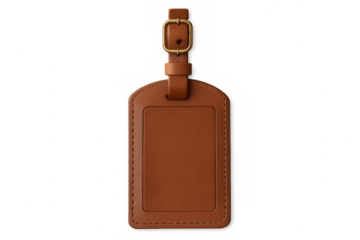 Brown leather luggage tag with golden buckle, close-up view, resting on transparent surface, awaiting personalization
