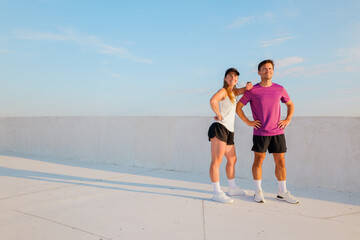 Fitness enthusiasts enjoying a sunny workout session at an outdoor location while showcasing their...