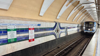 Subway train arriving at metro station in Tashkent, Uzbekistan