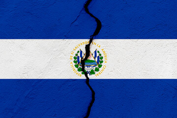 The flag of the Republic of El Salvador into a grunge cracked wall