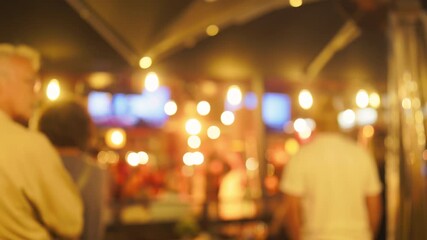 The captivating nightlife scene showcases warm lights and a lively crowd joyfully enjoying their time at the bar - Powered by Adobe