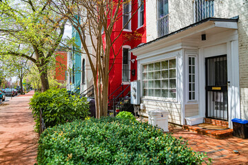 Warm colors and spring foliage highlight the character of a historic D.C. neighborhood.
