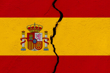 The flag of the Kingdom of Spain into a grunge cracked wall