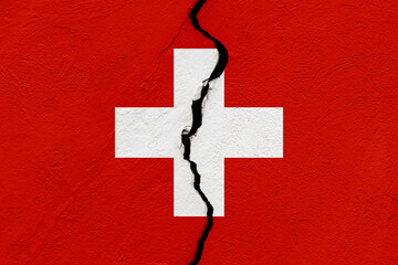 The flag of the Swiss Confederation or Switzerland into a grunge cracked wall