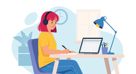 A young woman with headphones is diligently working on her laptop and writing notes at a home desk, embodying modern remote productivity and online learning.