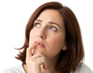 Fototapeta premium Woman with brown hair biting her fingernail and looking upwards conveying deep thought