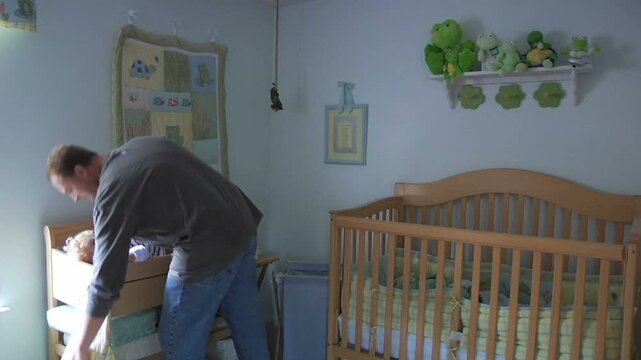 Father Changing Baby&rsquo;s Diaper at Home &ndash; Authentic Parenting Moment