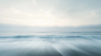 Obraz premium A soft long-exposure seascape with dreamy ocean waves and pale sky on the horizon, creating a tranquil and abstract atmosphere ideal for meditation, wellness, and design use 