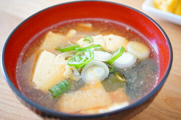 Child’s Homemade Miso Soup in Wooden Bowl