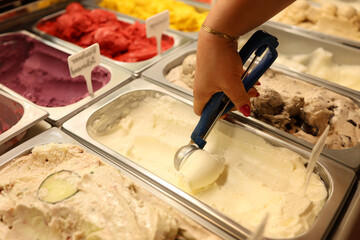 Woman serving ice cream in Confectionery shop