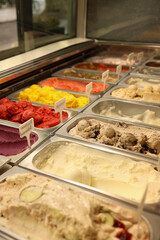 Woman serving ice cream in Confectionery shop