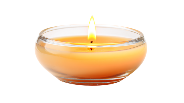 a candle is lit in a glass bowl