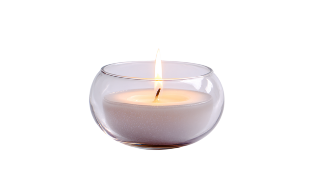 a candle is lit in a glass vase