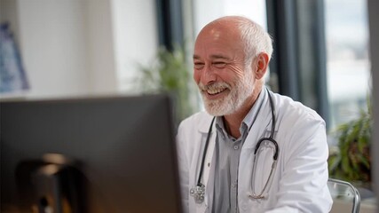 Senior doctor speaking to a patient on a virtual medical appointment through a computer, concept of telemedicine and using technology for healthcare services - Powered by Adobe