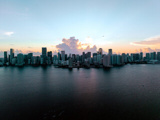 Fototapeta premium Drone view of downtown Miami skyline at sunset from over Biscayne Bay