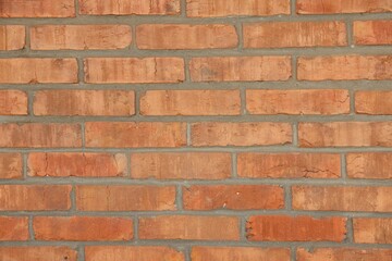 Texture of red brick wall as background, closeup