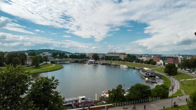 Time lapse of Visla Vistula river with tourist boats in Krakow, Poland
