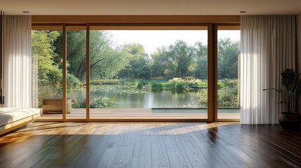 Spacious room with large glass sliding doors overlooking a serene lake surrounded by lush green trees under natural daylight