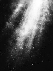 Obraz premium Bright scattered particles resembling a cosmic nebula or galaxy against a dark background creating a sense of vastness and mystery