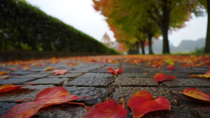 Autumn Leaves on Cobblestone Path in a Scenic Park Landscape with Trees in Background Fall Season Serenity
