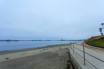Elevated over the beach sand Sail bay front walk on a gloomy overcast morning, San Diego, California