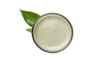 Matcha Delight: A vibrant top-down shot of a matcha latte with a lush tea leaf, inviting viewers to savor the moment.