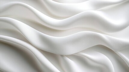 Obraz premium Soft smooth white fabric with gentle folds creating a flowing wave pattern and light shadows highlighting its silky texture