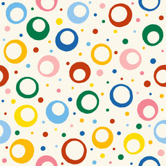 Colorful circle and dot seamless pattern on cream background, playful vector design