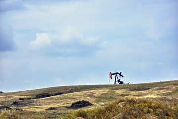 Pumpjack on hill
