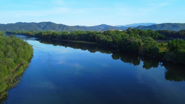 Aerial View of river, Beautiful Aerial View of African Jungles forest and River, Landscape in aerial drone shot. Adove calm tranquil river in Jijel Algeria North Africa, River and green fores trees