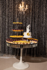 Wedding cake and cupcakes with sunflower decoration
