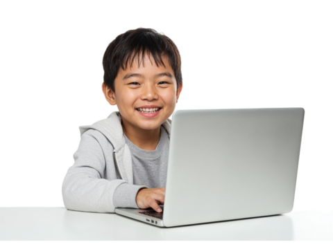 Happy young asian boy smiling while typing on a silver laptop computer isolated on transparent background