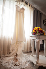 Wedding dress with bouquet and accessories 