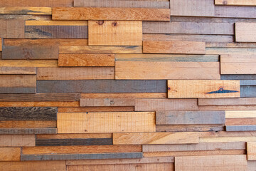 Fototapeta premium Photo of Vintage old wall house structure brown shiny wooden plank Lay horizontally as pattern. Abstract texture. House wall for background or website wallpaper. Wooden board.