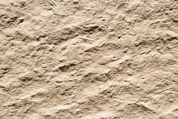 Brown color grunge cement or stone wall pattern. Concrete from walls of house can be used as model for building, house wall for background or website wallpaper. Texture background abstract.