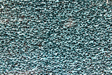 Old green plastic wall background, rough texture pattern. Walls of house can be used as model for...