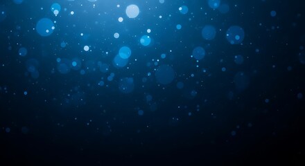 Obraz premium Abstract background of glowing blue bokeh lights in the dark water