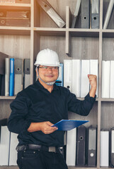 Vertical Horizon Portrait Civil Construction engineer man holding blueprint file folder on site...