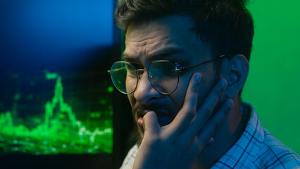 Close up face nervous Arabian Indian man looking computer monitor data problem trouble male guy...