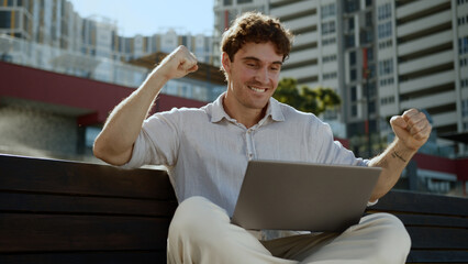 Happy Caucasian man business city freelancer working laptop computer win victory emotional male...