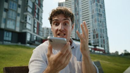Angry Caucasian man talking mobile phone smartphone shout scream boss director quarrel conflict...