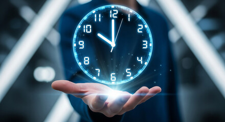 A hand holding a holographic clock face with a futuristic, glowing design. The background features a blurred, blue-toned setting with soft lights, suggesting a high-tech or digital environment.