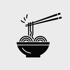 Black silhouette of chopsticks lifting delicious noodles from a bowl