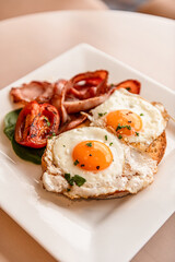 Fried Eggs & Bacon On Toast With Tomato