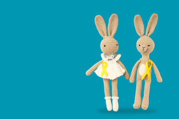 Handmade bunnies display friendship with yellow ribbons