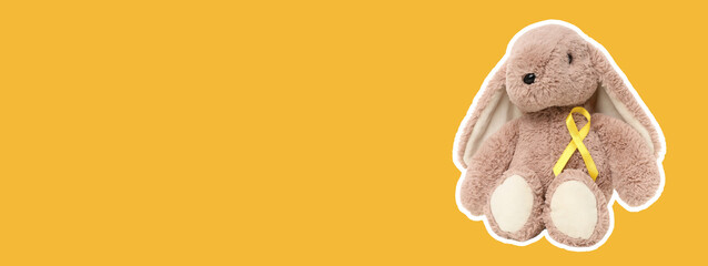 Cute stuffed bunny toy with a cheerful yellow ribbon on display