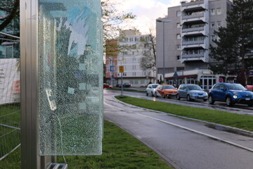 A phone booth with a window that is covered in condensation